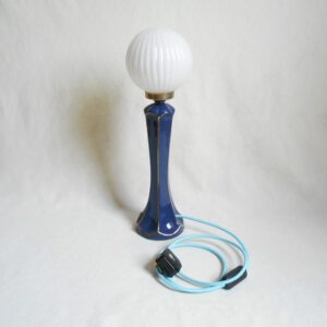 A blue ceramic table lamp by Fiona Bradshaw Designs